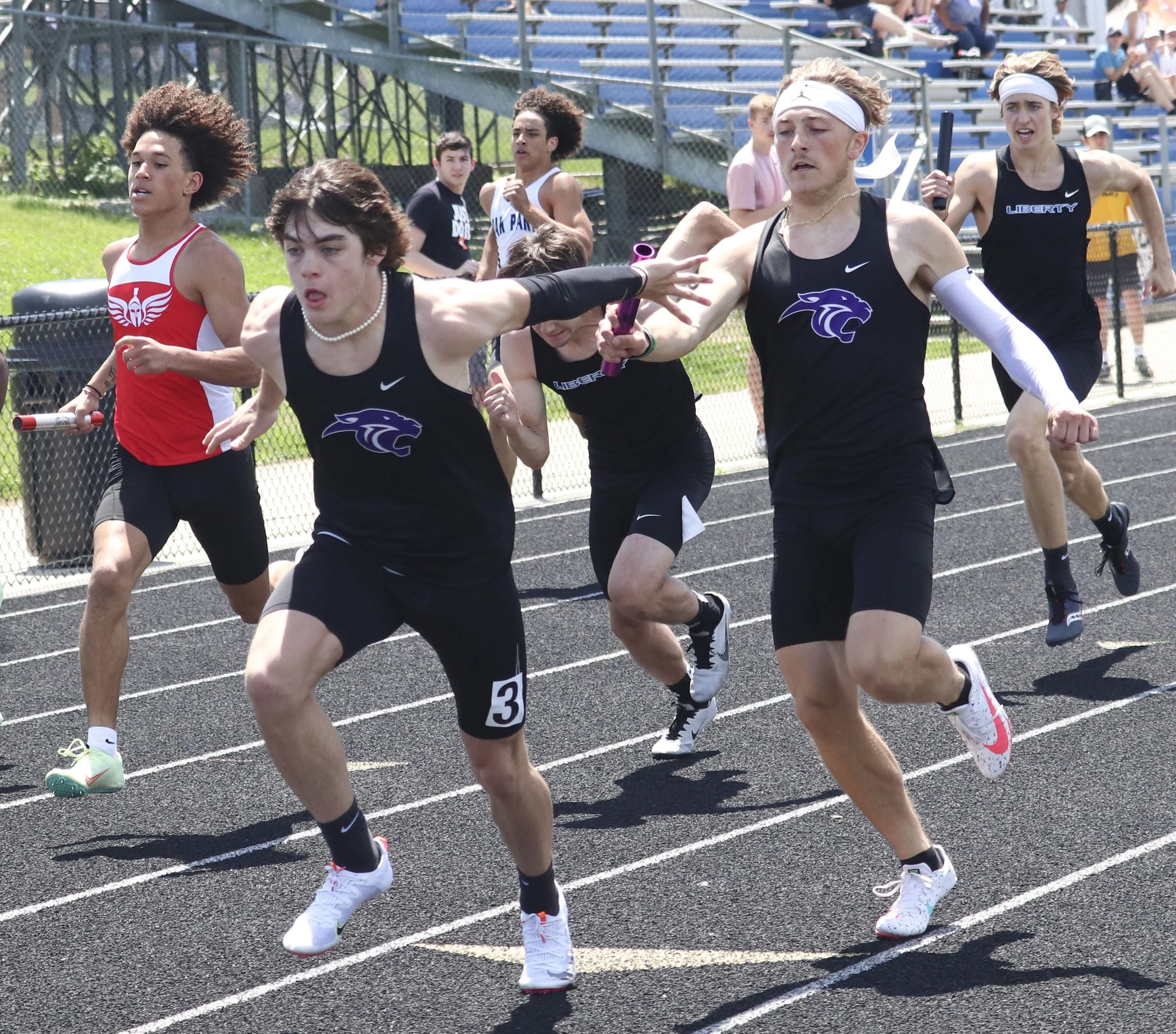 PHS boys 4x200 3rd leg to anchor.jpg