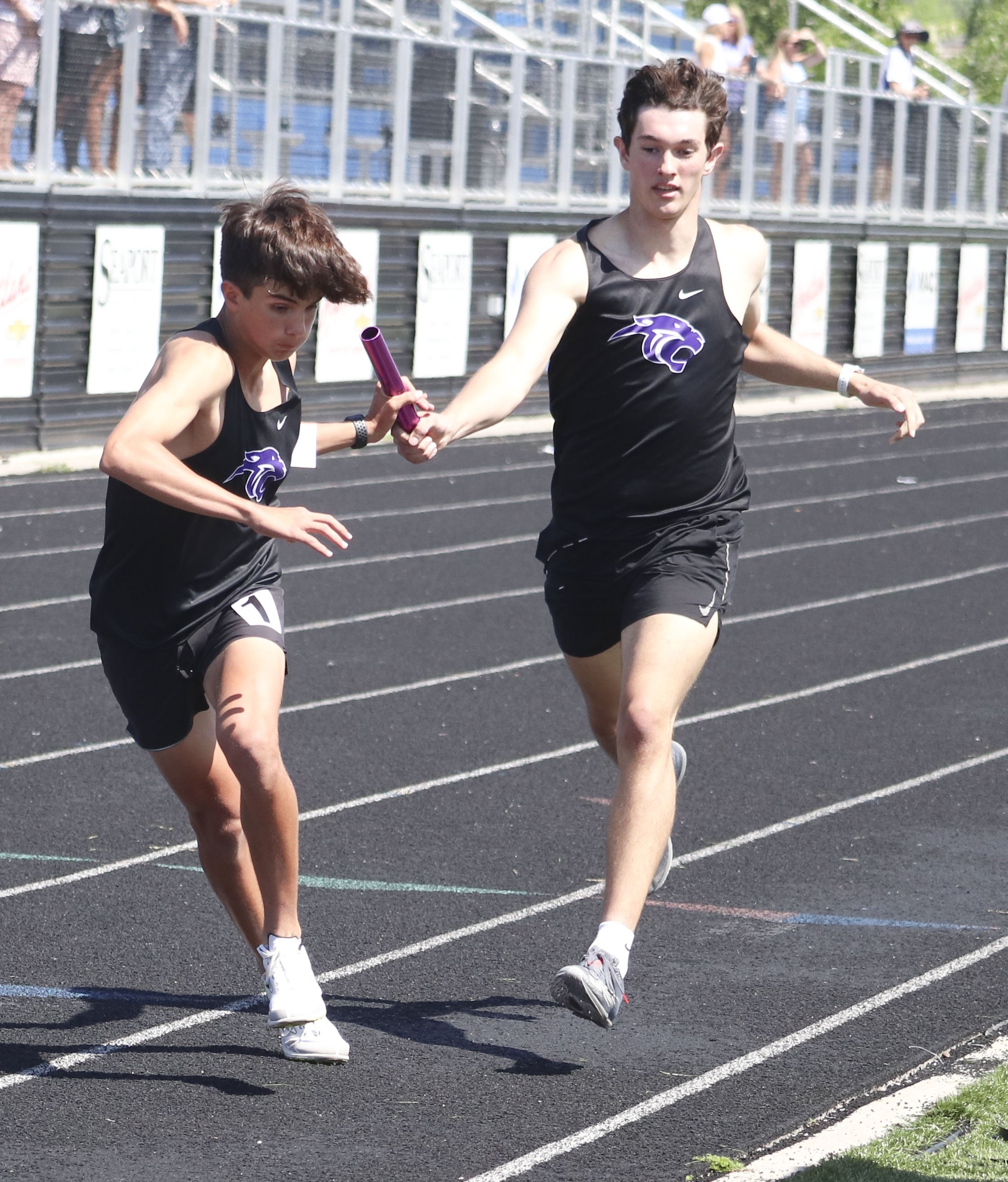 PHS boys 4x800 final handoff.jpg