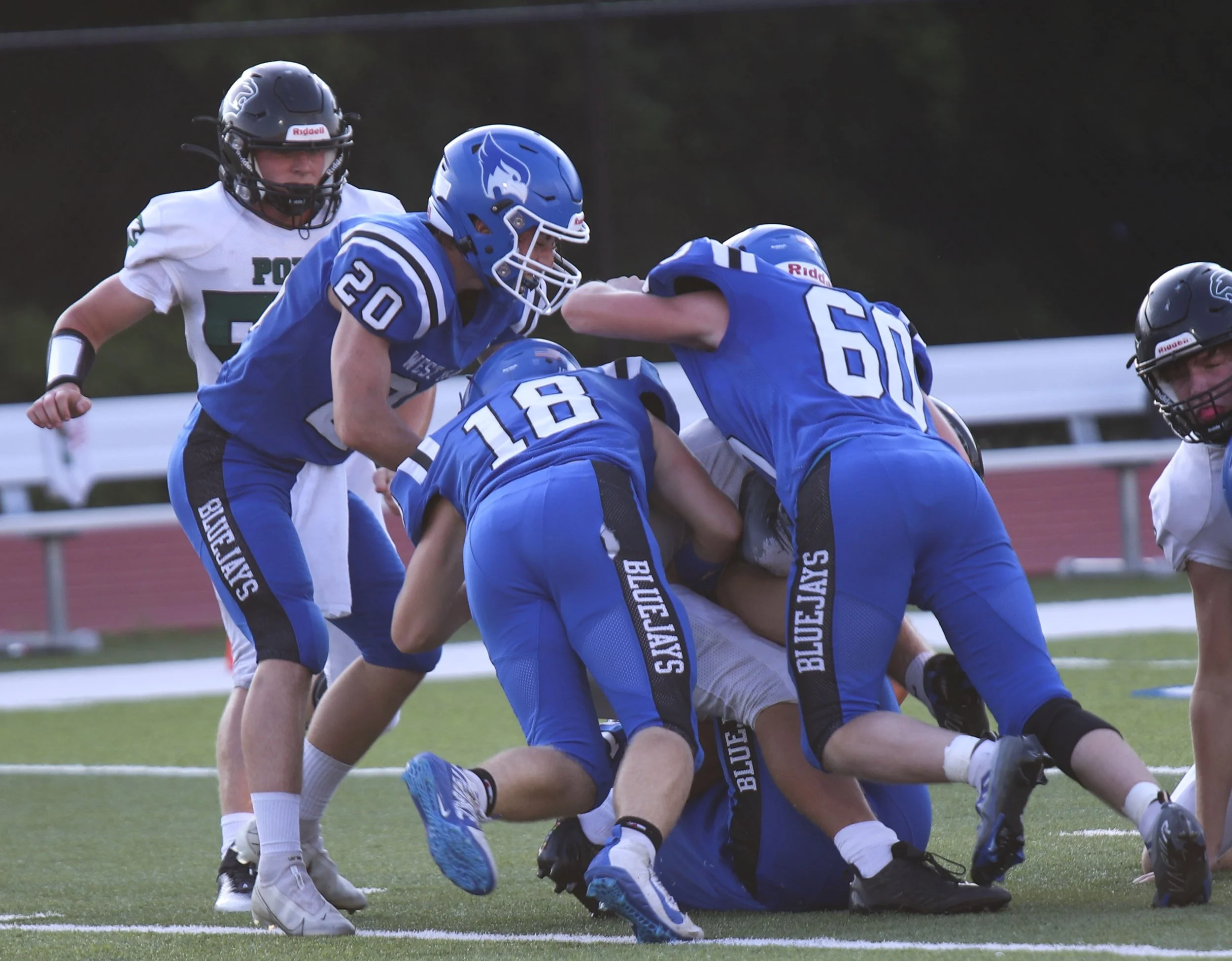 Christian Larrabee_Peyson Chandler_Josh Brown tackle.jpg