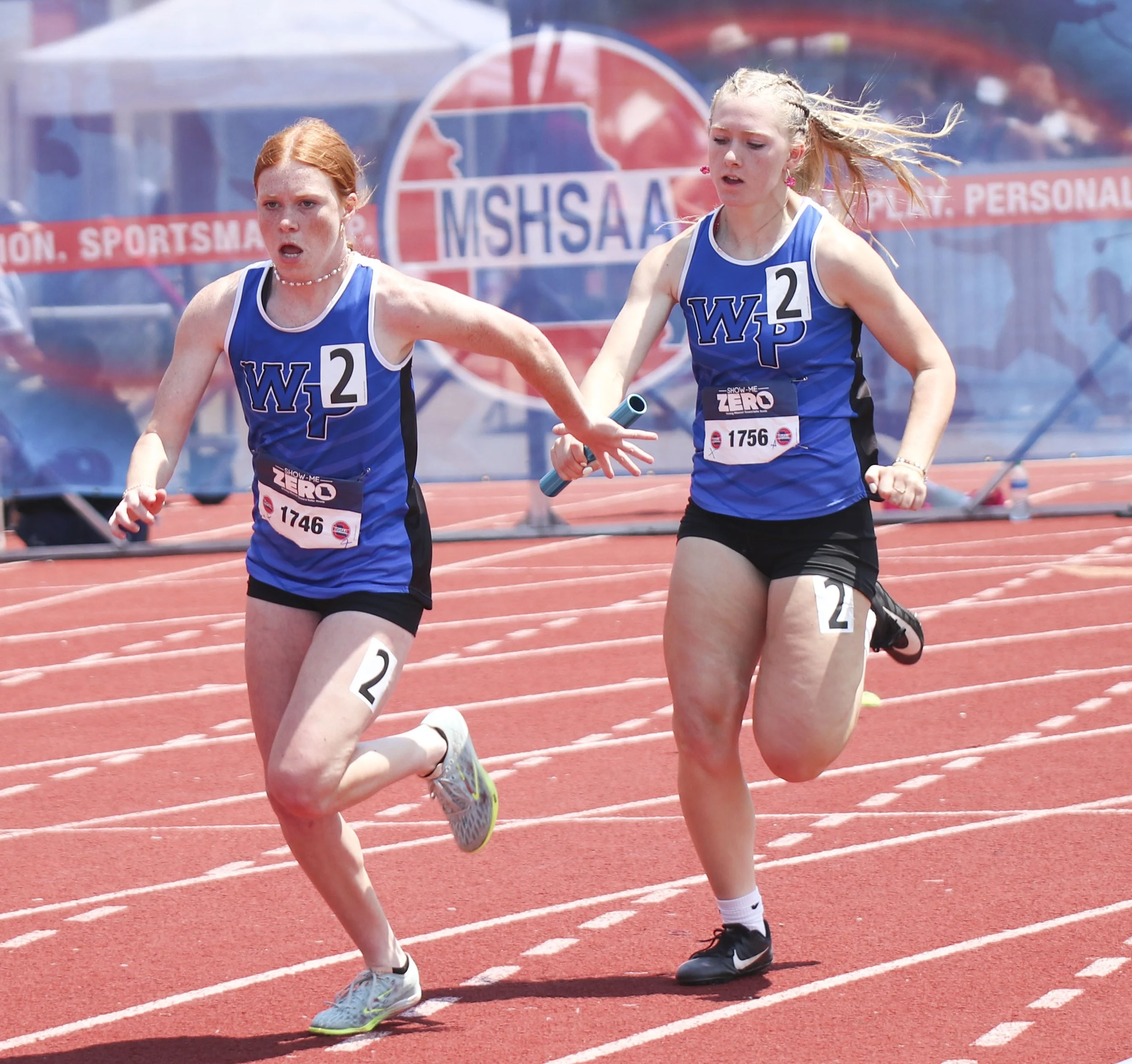 Girls 4x200 - Sam Baker handoff.jpg