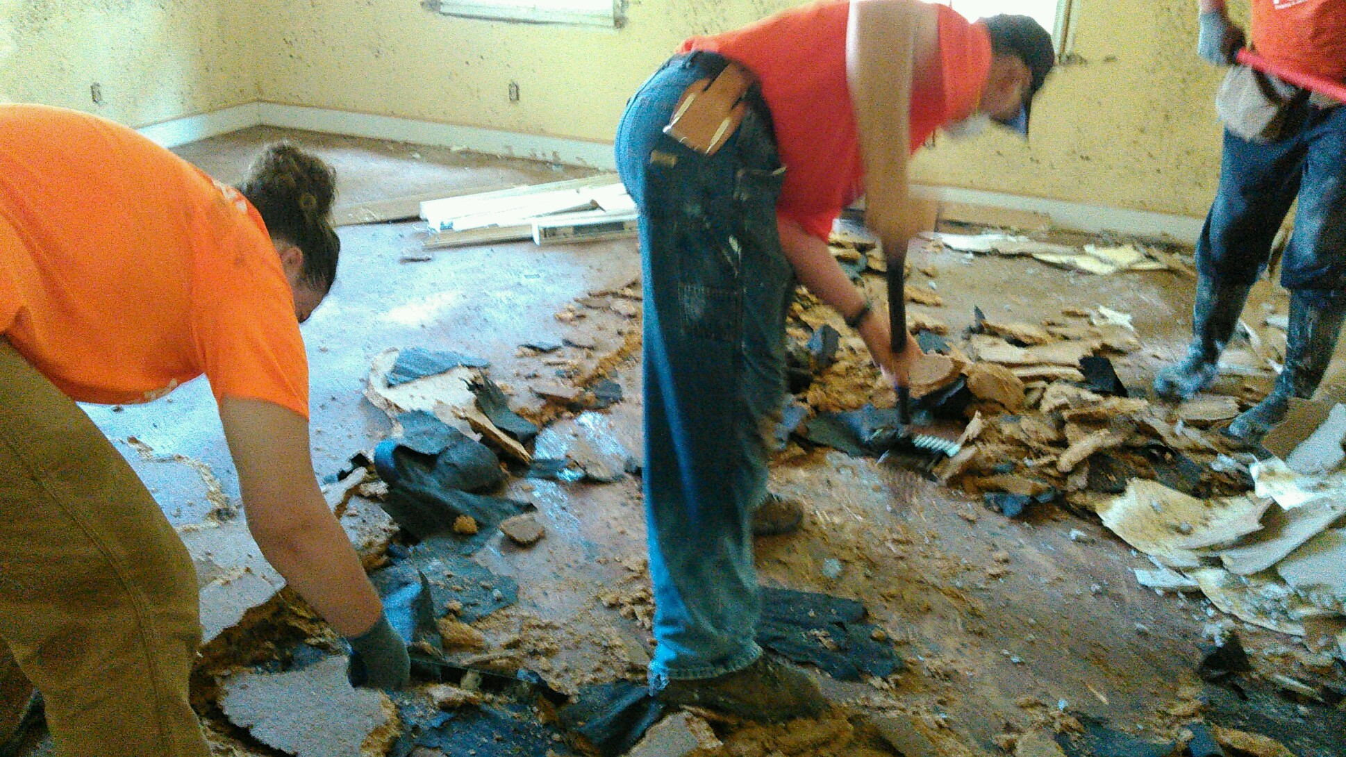 After the furnishings were removed to the roadside for pick-up the floor had to be removed down to the sub-floor.