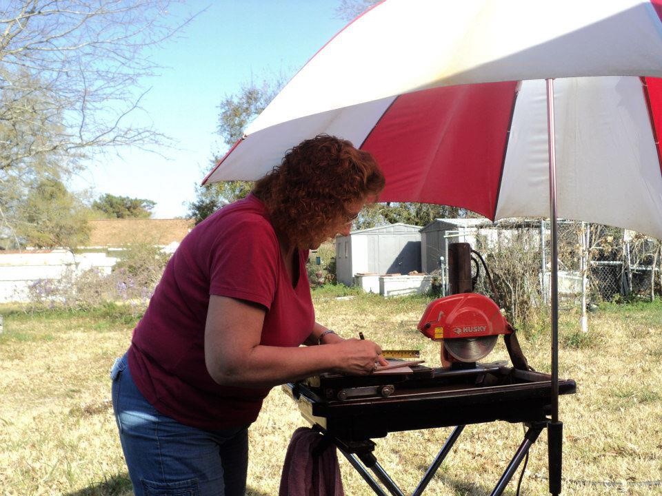 Barb cuts tile.