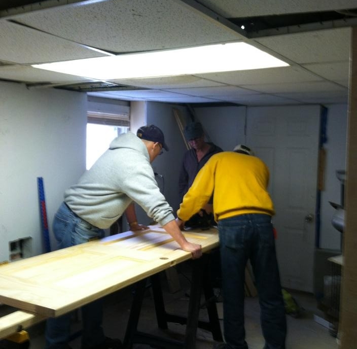 Gene and Terry work on one of the seven doors we replaced for this home owner.