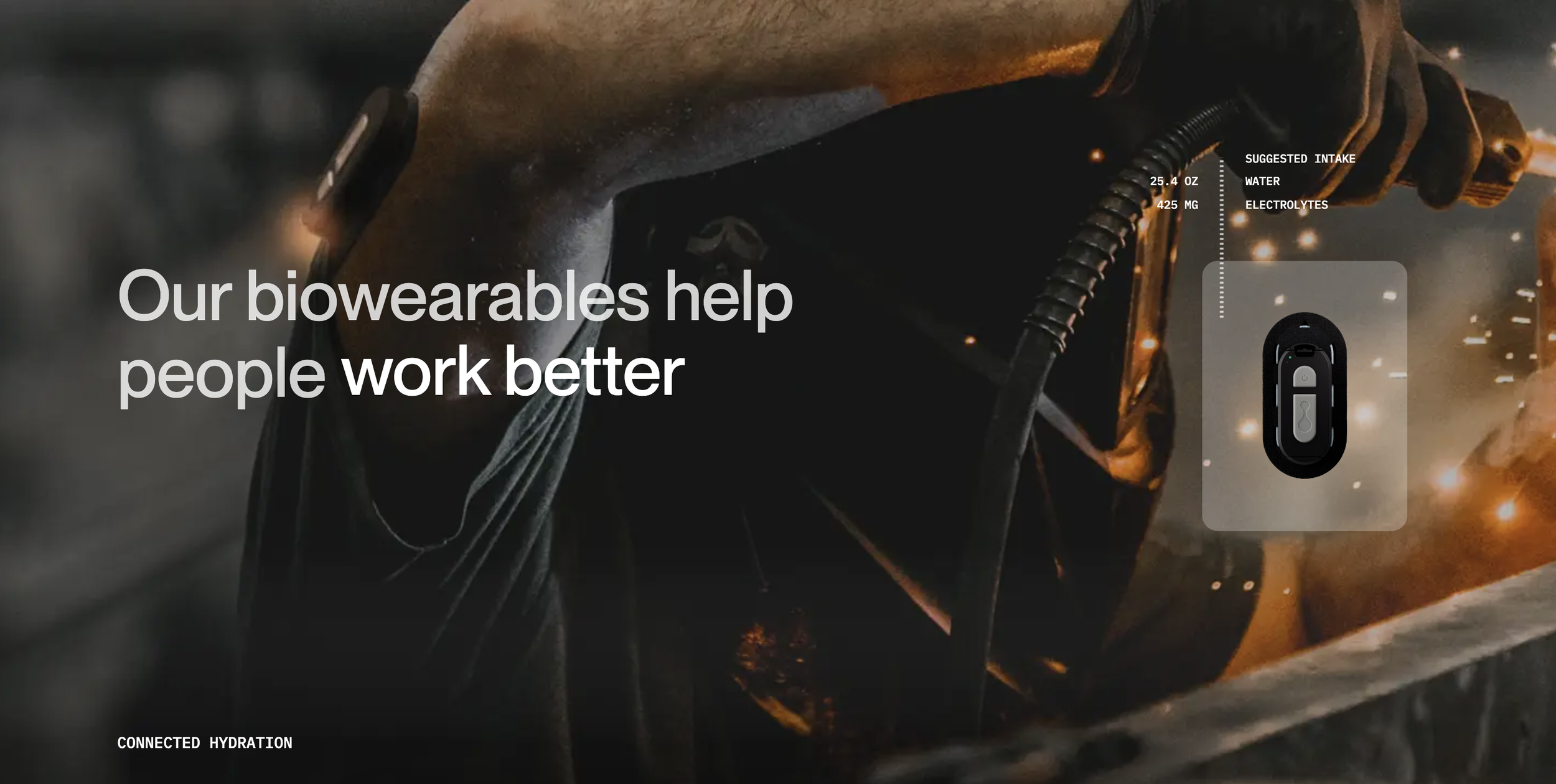 Close-up image of a worker wearing protective gear and holding a power tool, with sparks and smoke in the background, promoting biowearables for improved work productivity.