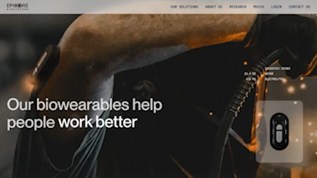 Close-up of a sector of a brown leather glove showing electronic components and wiring, with digital interface overlay from a website.