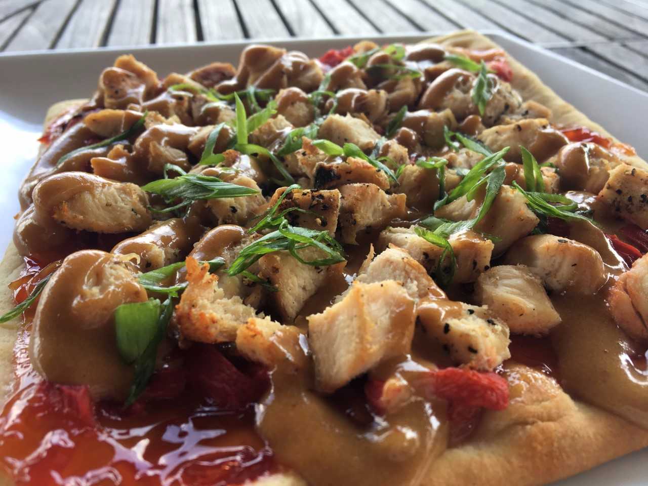 Thai Chicken Flatbread - sweet chili chicken, roasted red peppers, green onion & cilantro drizzled with spicy peanut sauce. "Just one of our four flatbreads on the new menu. This one is a take on Pad Thai."