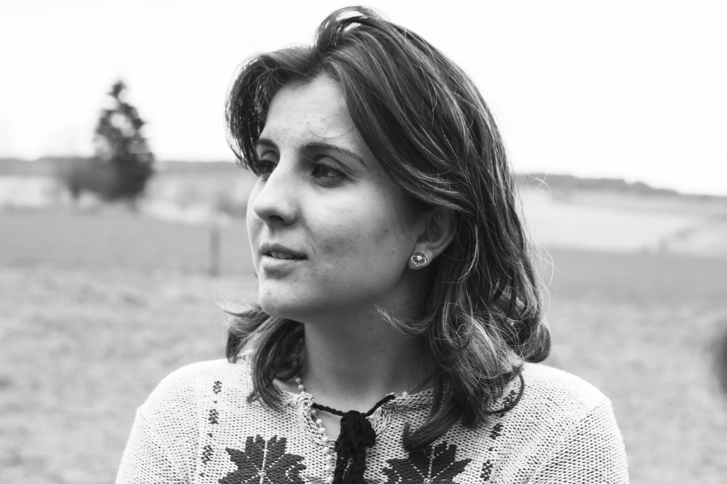Mariam stands in a field in the Czech countryside. February 2016.