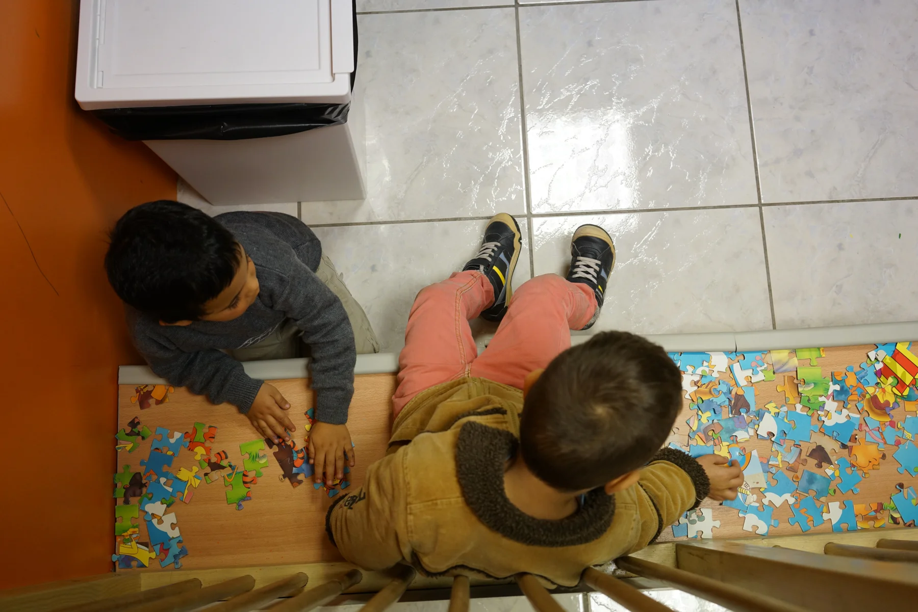Children play at the Faros Walk-in Center off Victoria Square.