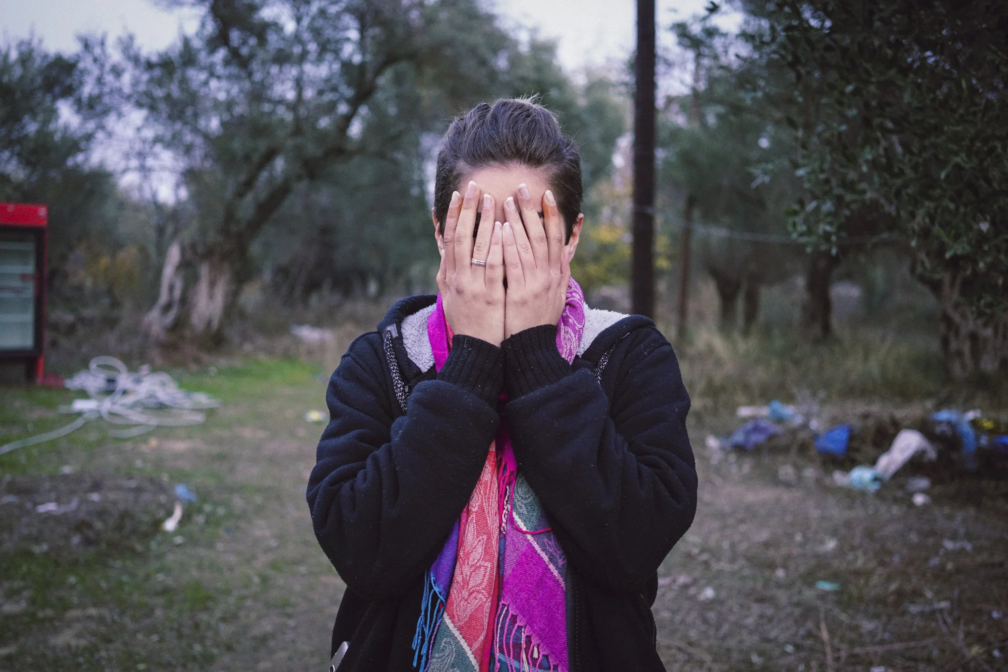 Merjan* standing outside Moria Camp, Lesvos, Greece. November 2016. Photo: Talitha Brauer