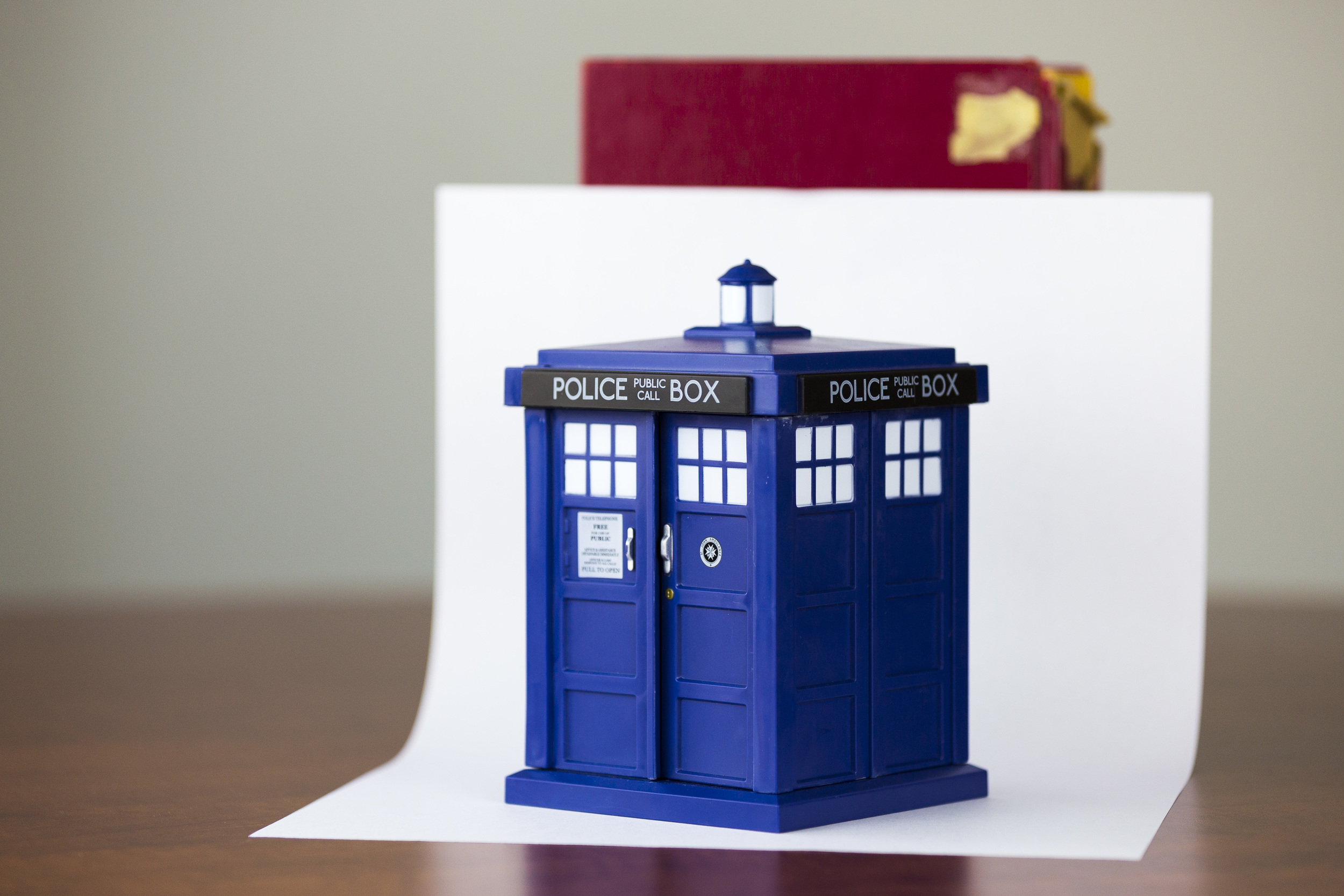 PROFESSIONALISM THROUGHOUT TIME AND SPACE: Using a sheet of paper at an angle is a great and cheap way to create a backdrop for product photography. If you have items that are larger than the paper, use a white wall or something with a smooth, single color, surface to shoot your images. 