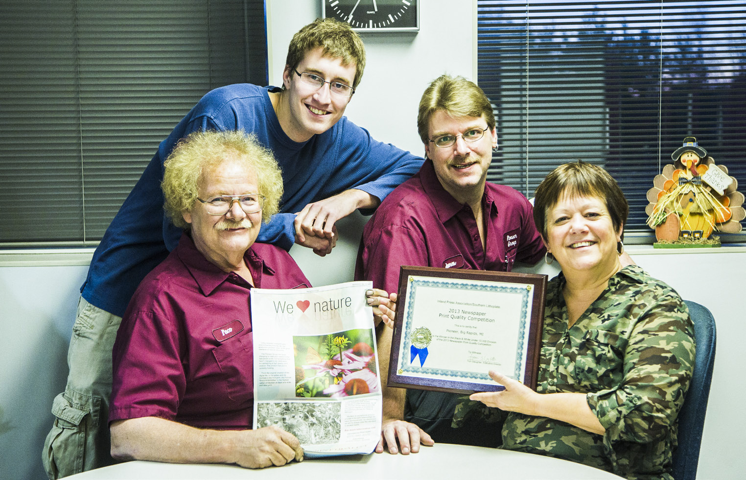 BACK IN THE DAY: Pictured (from left) is Paco, myself, James VanderMaas and Sue Vallenti. This photo was taken back in 2013 when the Pioneer Print Division won first place in the Inland Printing Association’s print quality contest for Black and White Under 10,000 Division. I helped calibrate the color values of the photographs so they printed their best on our press.
