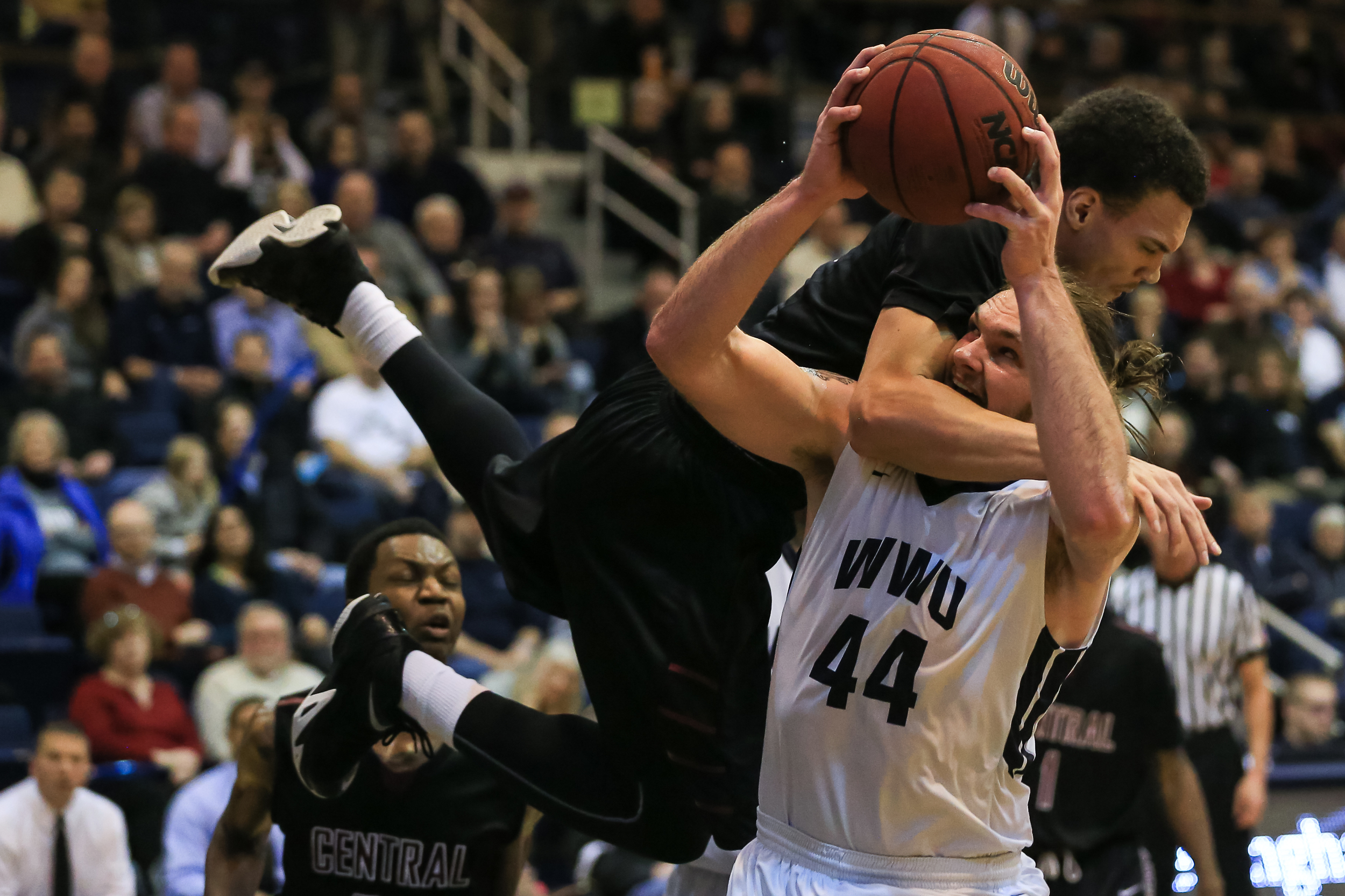 Junior Mac Johnson takes a hard foul from a Central Wildcat as he goes up for a shot. Western beat Central 83-77.