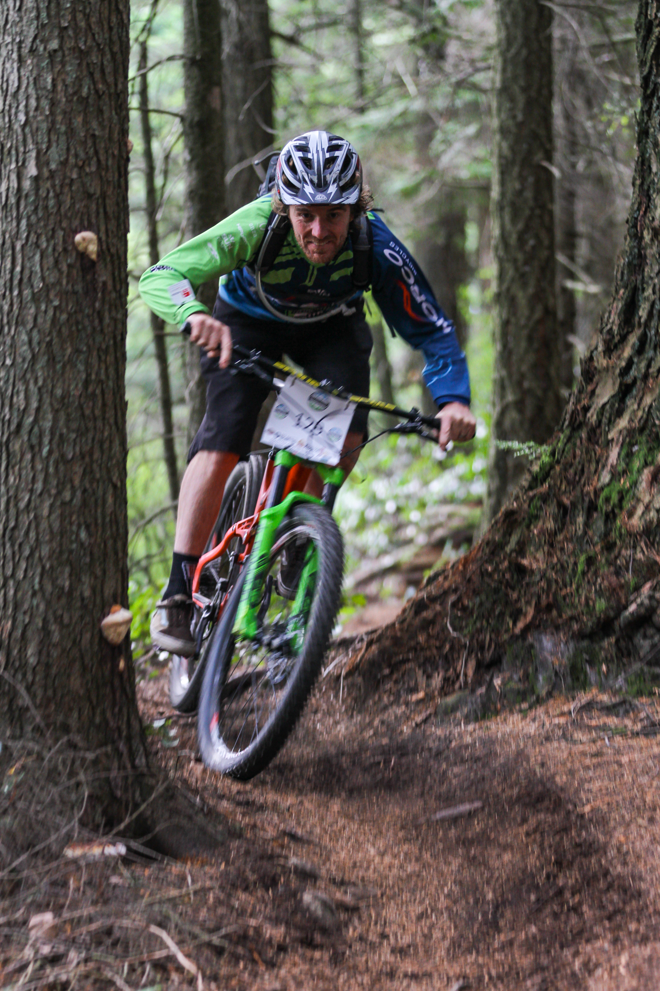   A mountain biker rides through trees during stage two of the Enduro of Subdued Excitement at Larrabee State Park, in Bellingham, Wash., on Saturday, Oct. 17, 2015.  