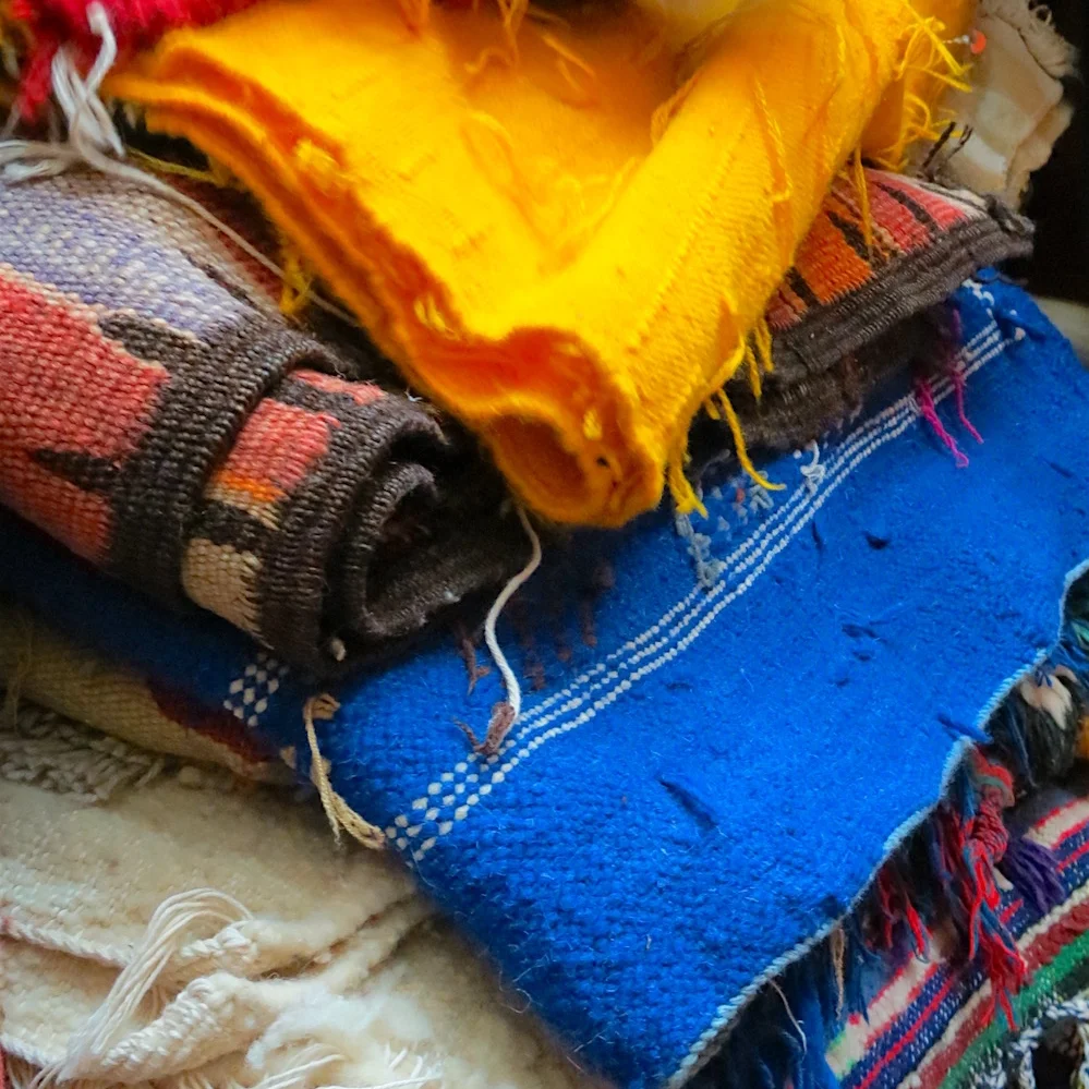 Stack of carpets for sale in Casablanca's Habous Quarter