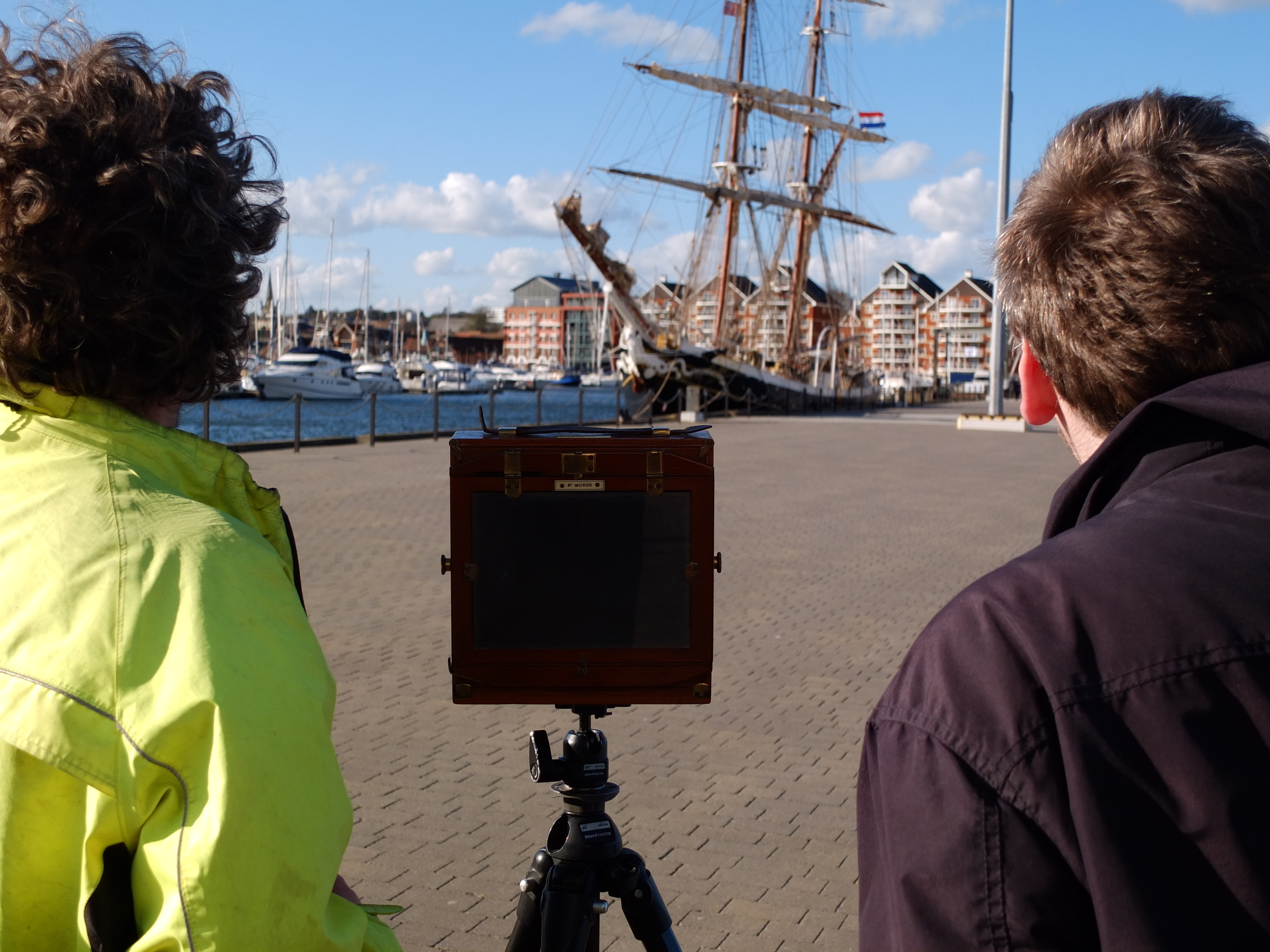 Tim and one of the star participants, Joel, taking a photo of a square rig on the marina