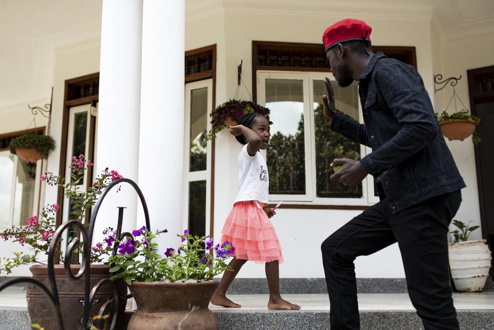  Bobi Wine interacts with his daughter Suubi in their home on the 31 September 2019 in Kampala, Uganda. Wine and his wife Barbara have four children together: Solomon, Shalom, Shadraq and Suub. When asked what his children think about his work life h