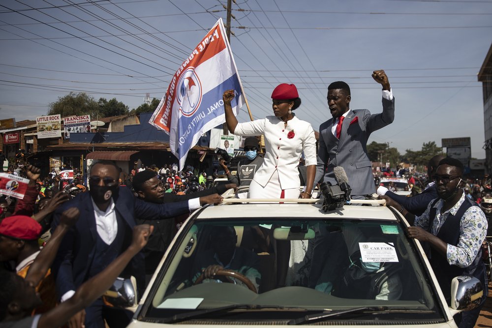  Bobi Wine is seen with his wife, Barbara, parading though the streets past crowds of supporters prior to him submitting his presidential nomination on November 03, 2020 in Kampala, Uganda. The presidential nominations, where presidential aspirants r