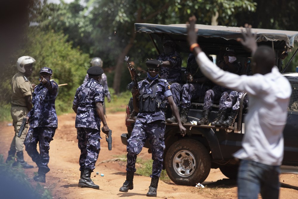  Police fire live rounds just outside a medical center where two colleagues of Bobi Wine were being treated on December 01, 2020 in Jinja, Uganda. The two were injured by security forces during Wine's campaign. 