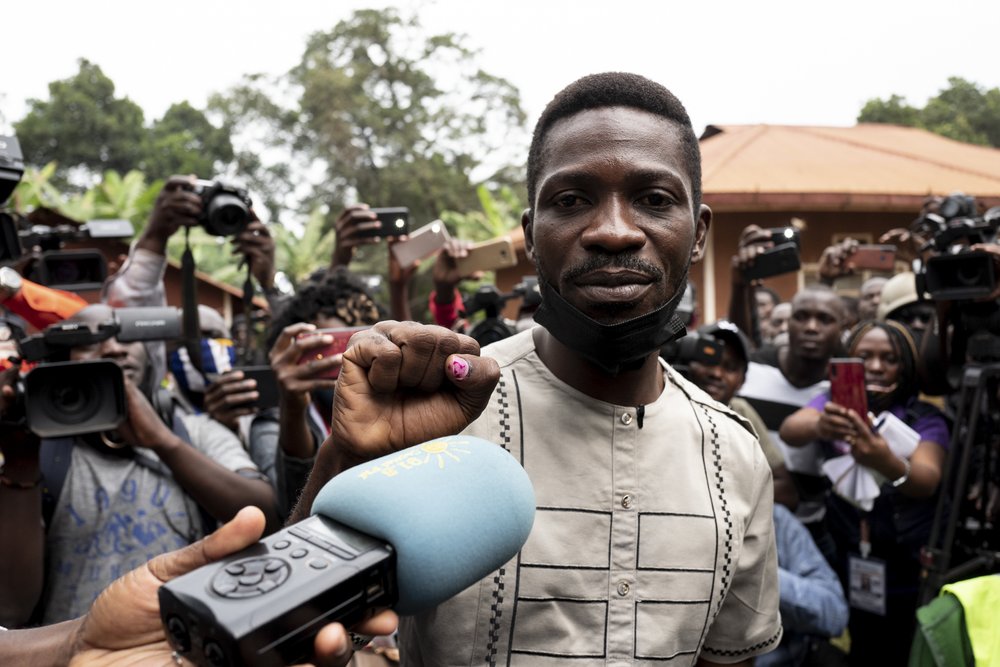  Bobi Wine makes his raised fist gesture after voting in the Ugandan presidential elections on January 14, 2021 in Kampala, Uganda. 