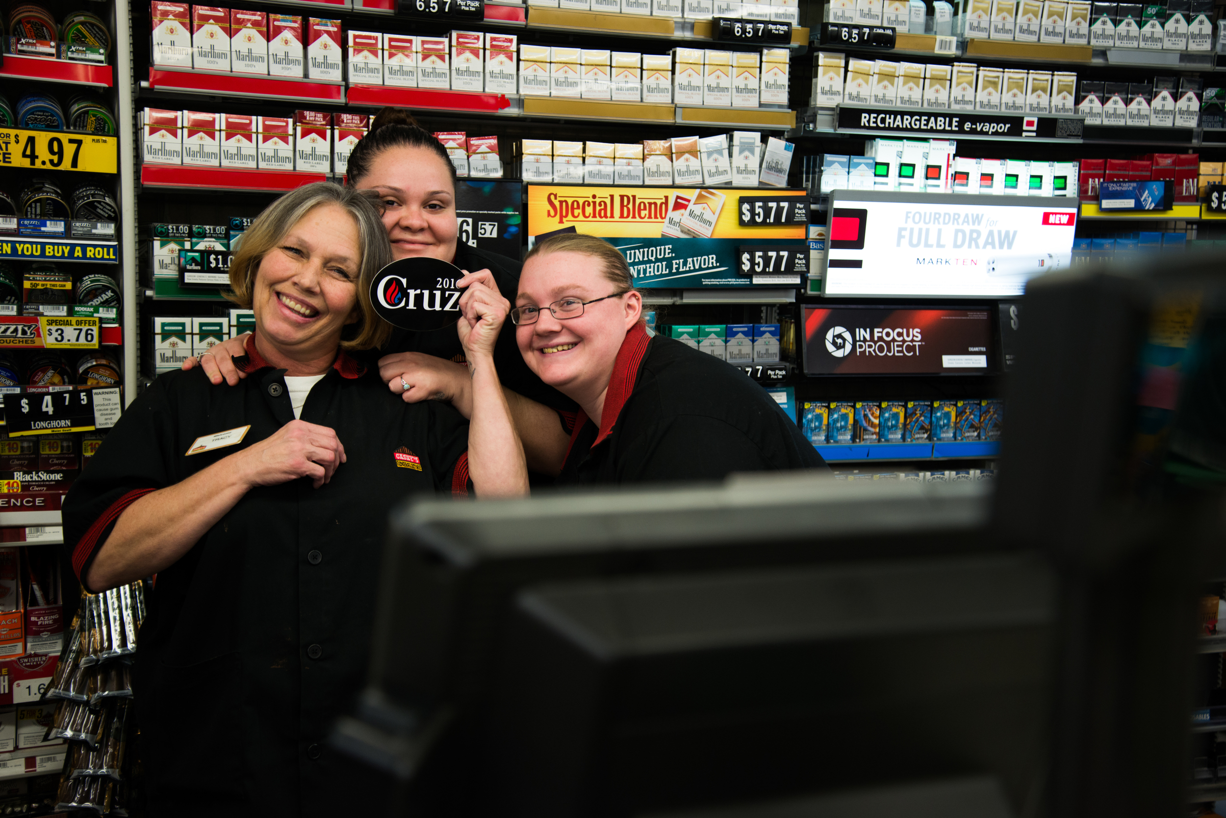  Tracy McClure (from left) Denise Lopez, and Alexis White, employees of Casey’s General Store in Tama, Iowa, pose for a photograph during a campaign stop of Republican presidential candidate Ted Cruz on Nov. 29, 2015. 