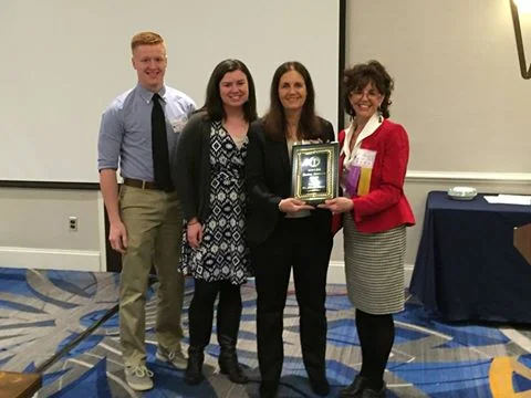 Diana Owen receiving her award from MSCSS president, Marcie Taylor-Thoma.