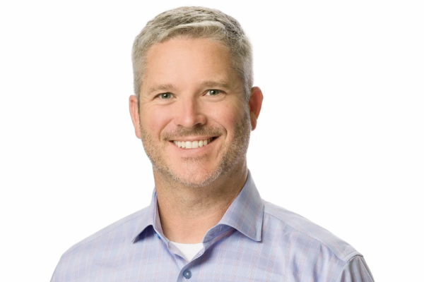 Dr. C.J. Henley, a dentist in San Marco, Jacksonville, smiling against a white background.