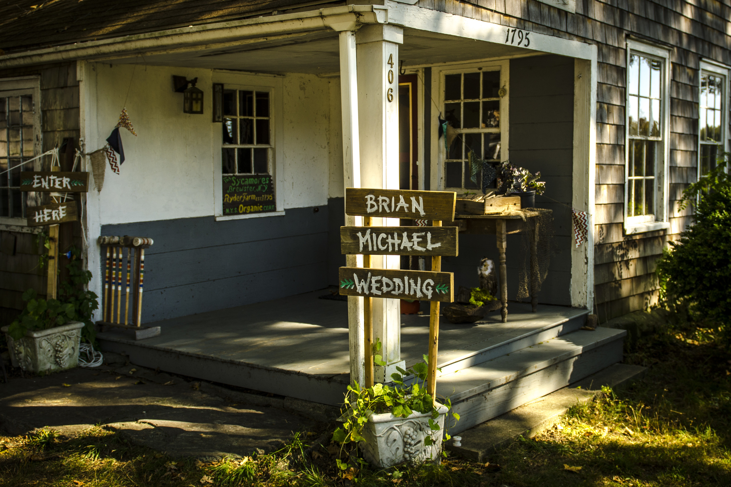 Rustic signs welcome guests to The Sycamores.