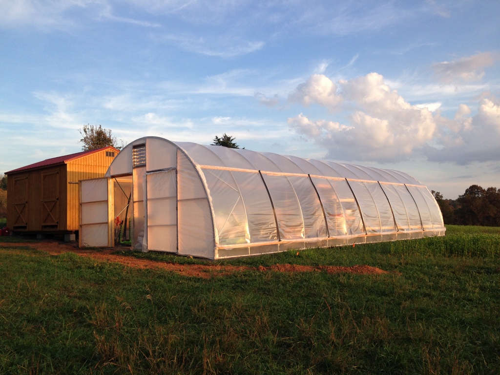 So new and clean: The walk-in fridge shed to left, and the greenhouse / wash-pack / office / shop / farm stand to right.