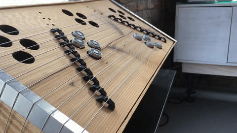 Electromagnets in the sculpture vibrate the metal strings to create the sound.