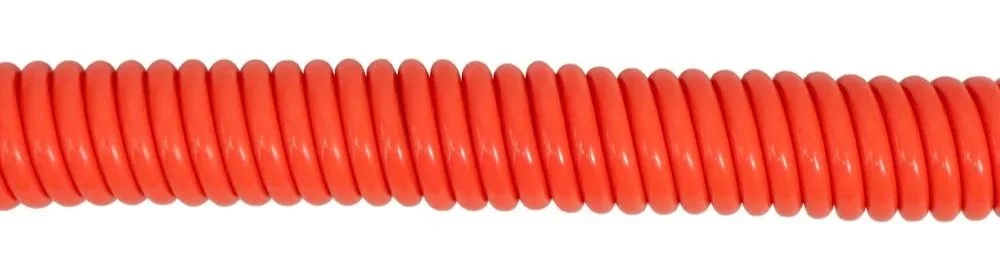 Close-up of a coral colour 10' coil leash.