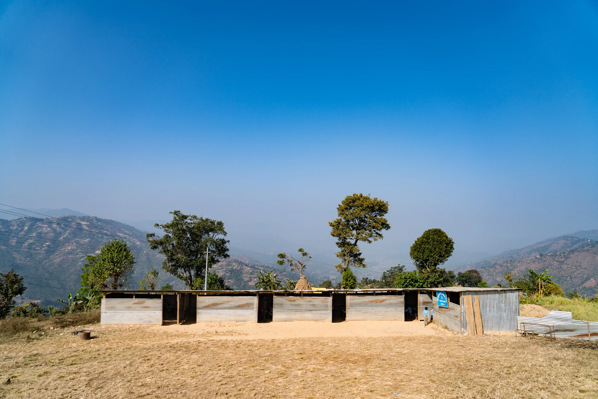 Post earthquake temporary school made out of corrugated sheet metal that would collapse on the slightest tremor.