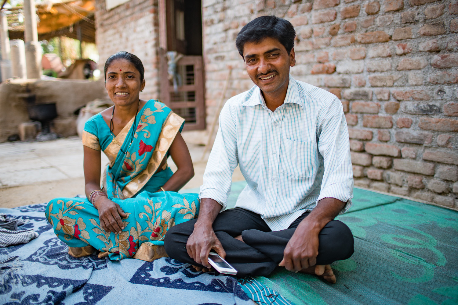 Husband and wife dairy farmers in India.