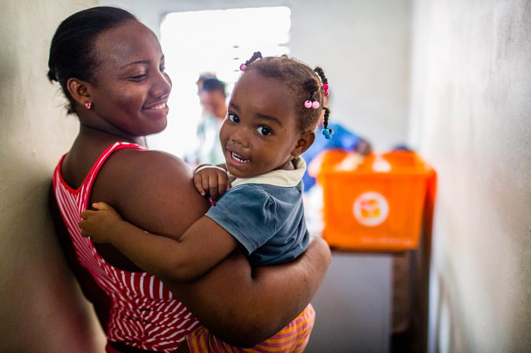 Working with AbbVie and Direct Relief documenting the emergency relief efforts in villages affected by hurricane Matthew in the Dominican Republic. This is a mother and child waiting their turn to see a doctor and get medications in the Monte Plata region of the Dominican Republic. We were in a tiny village community clinic overflowing with old people, plenty of babies and families waiting in very hot and humid conditions with an overwhelming smell of raw sewage from the flooding.