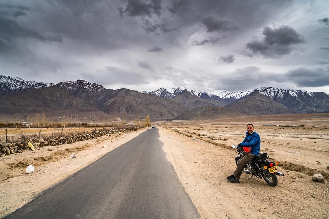 Riding the Himalayas on a Royal Enfield motorcycle. The bike is underpowered, heavy, and terrible brakes, but amazing to ride through the Himalayas. Always find time to do things that make you happy. Love what you do, and it will love you back!
