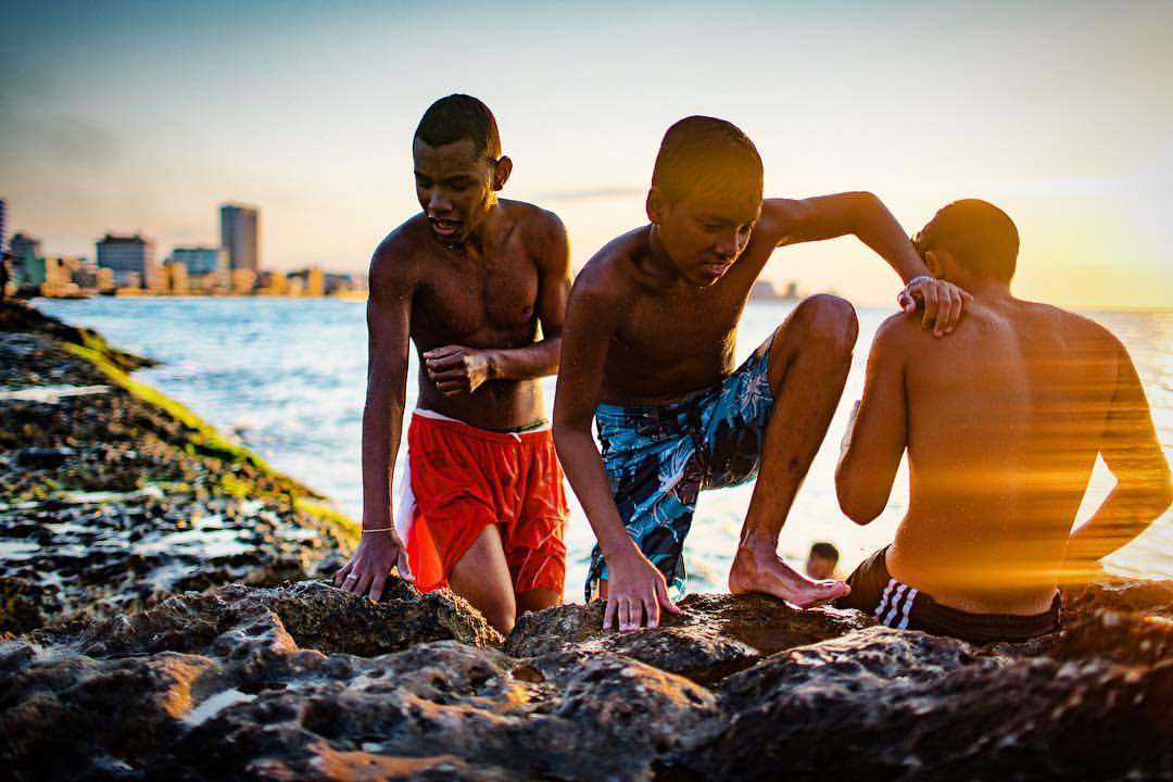 I spent a little time with these guys who were swimming at sunset off the Malecon in Havana, Cuba. Amazing light and always something different going on.