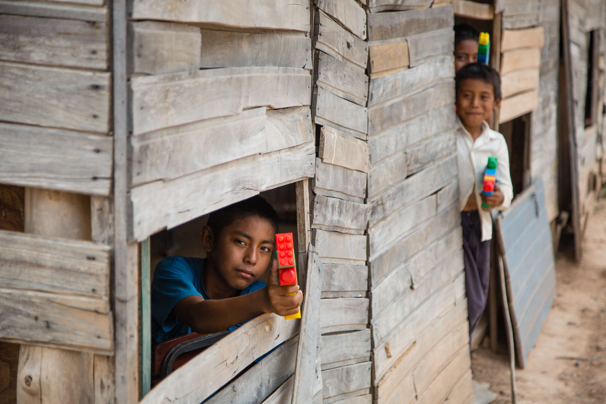 At an indigenous settlement In the Chaco region of Paraguay. An area struggling with poverty, scarce water, lack of opportunity. These kids have no toys but they make rifles with a few legos.