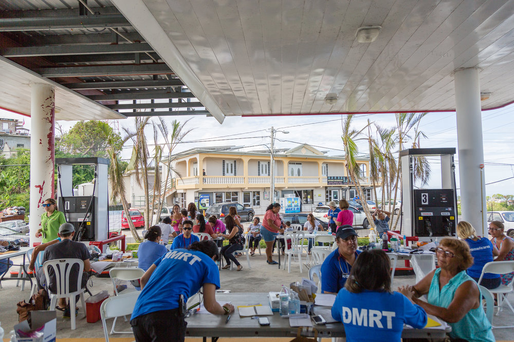 A temporary health clinic set up in a closed gas station damaged by hurricane Maria