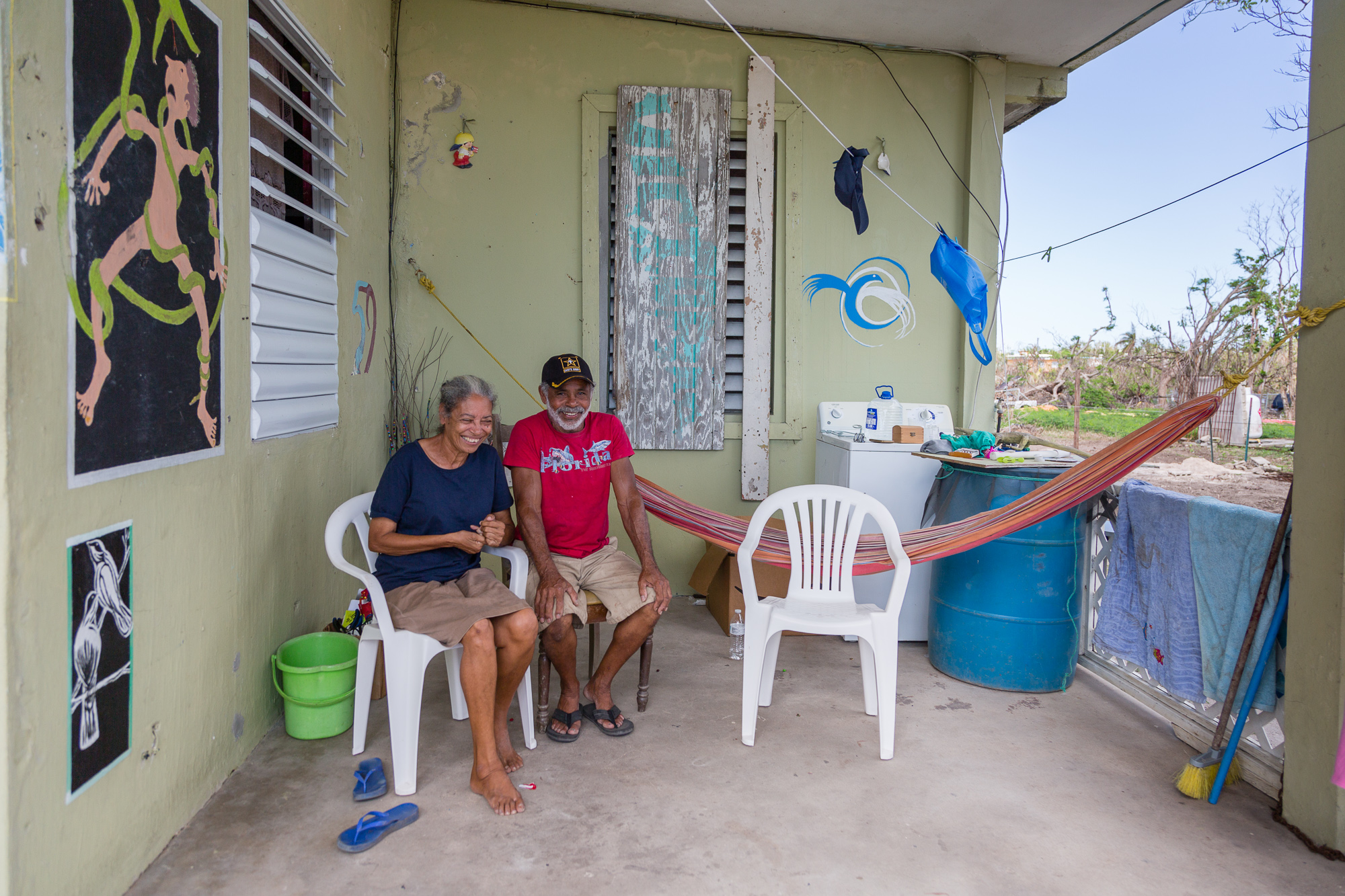 An artist and his wife rode out the storm at their waterfront home with the waves crashing at their door. Vieques, Puerto Rico.