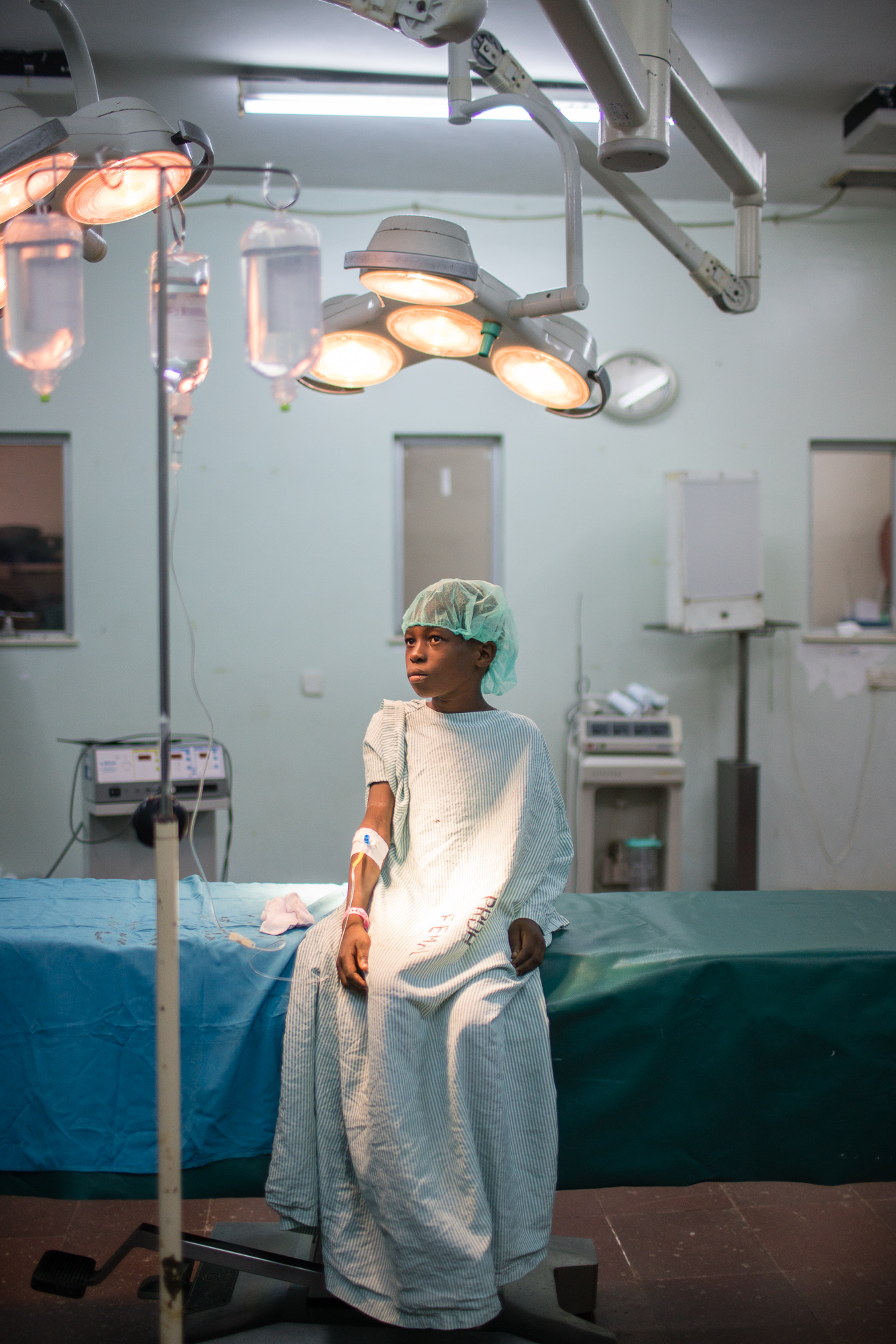 A young boy with old burn wounds wating for surgery that will change his life in Mombassa, Kenya