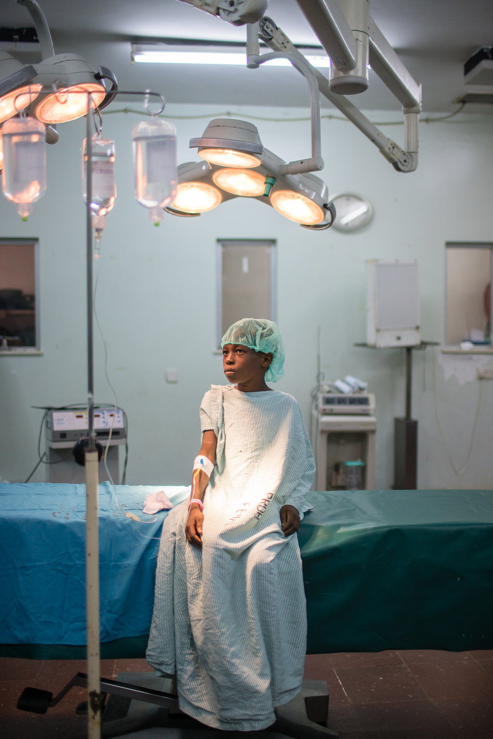 A young boy with old burn wounds wating for surgery that will change his life in Mombassa, Kenya