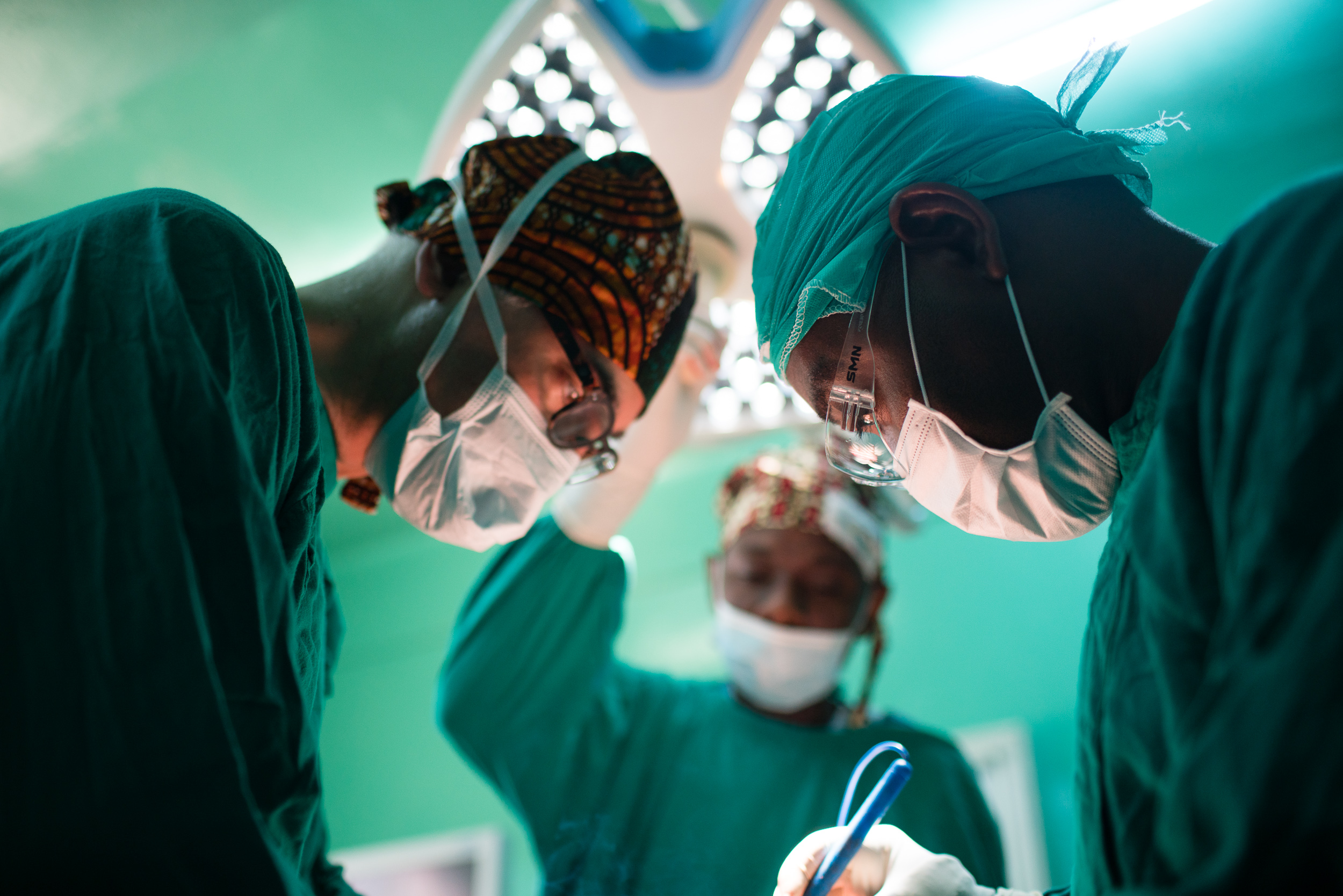 Photographed surgeons in Kenya and Tanzania changing peoples lives by sharing plastic surgery techniques.