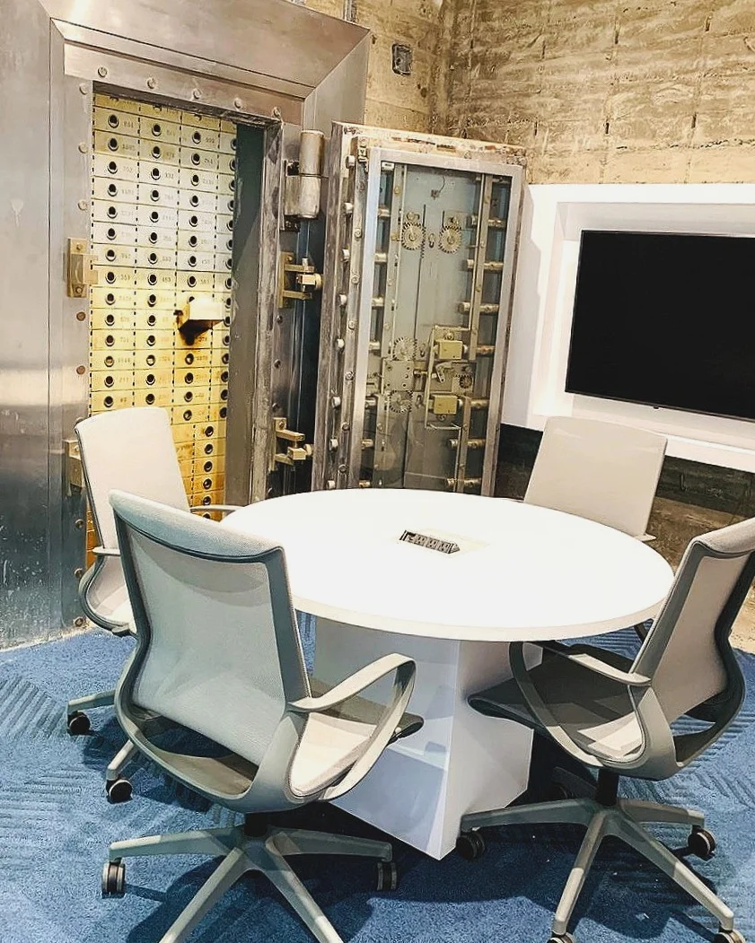 The original vault door from 1954 was kept and serves as a white board within our conference room “New York”.