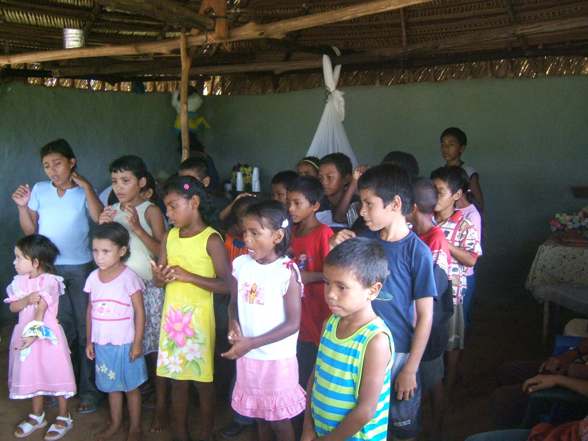  This group of children are learning a new song about God. They enjoy animating to the music. 
