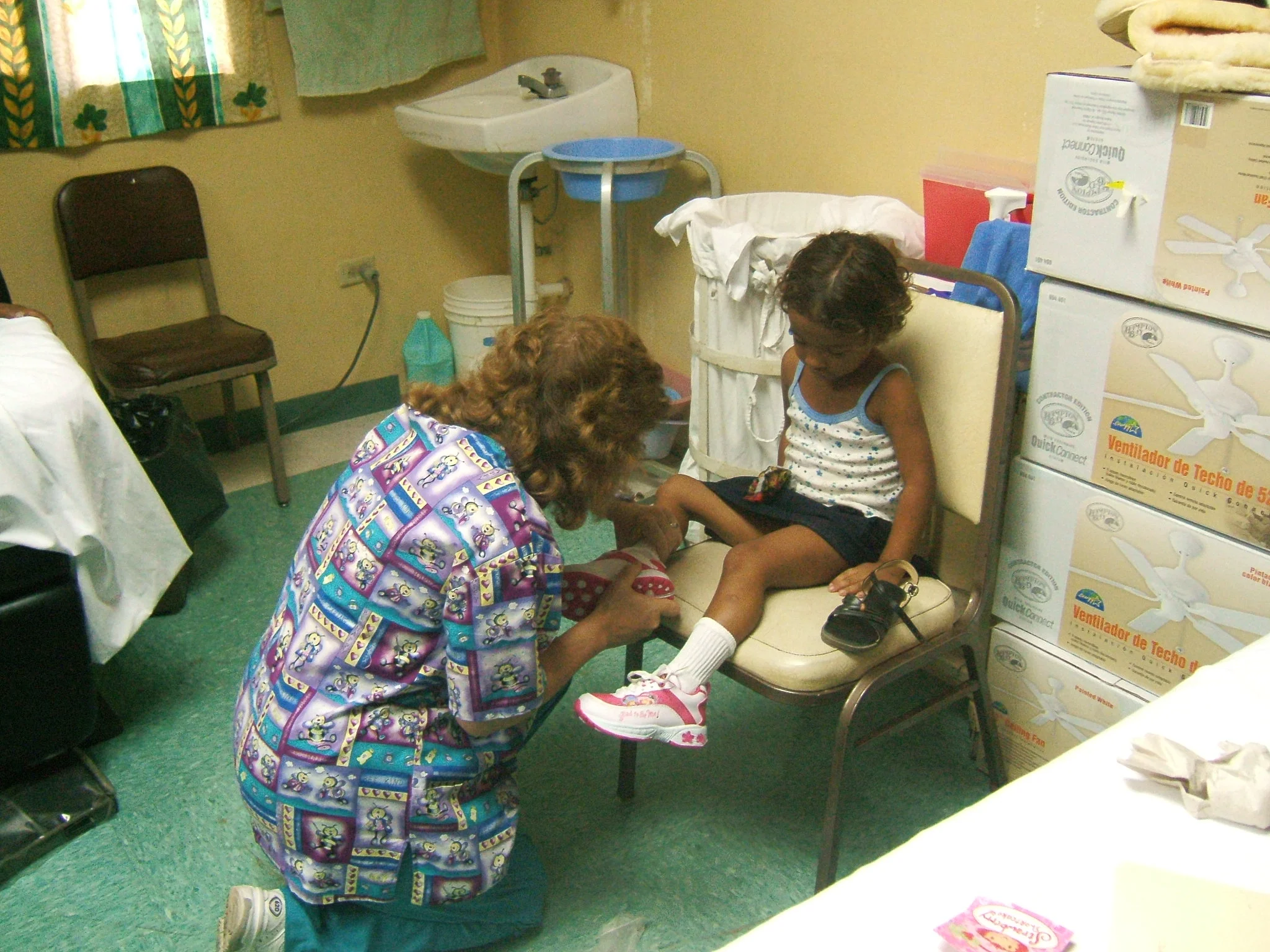  Sometimes we get to help out, an individual with a personal need. In this case, this little girl, is trying on, here first pair of new shoes 