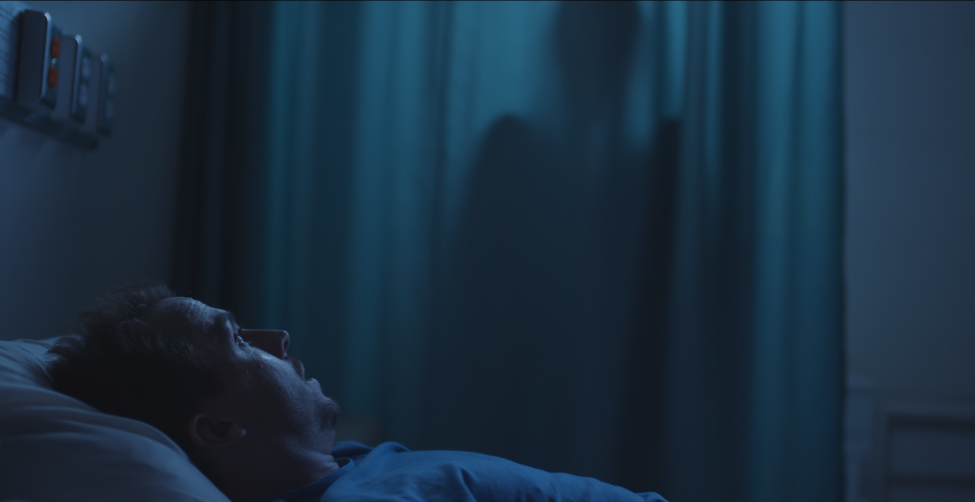 J+with+curtain+silhouette.png
