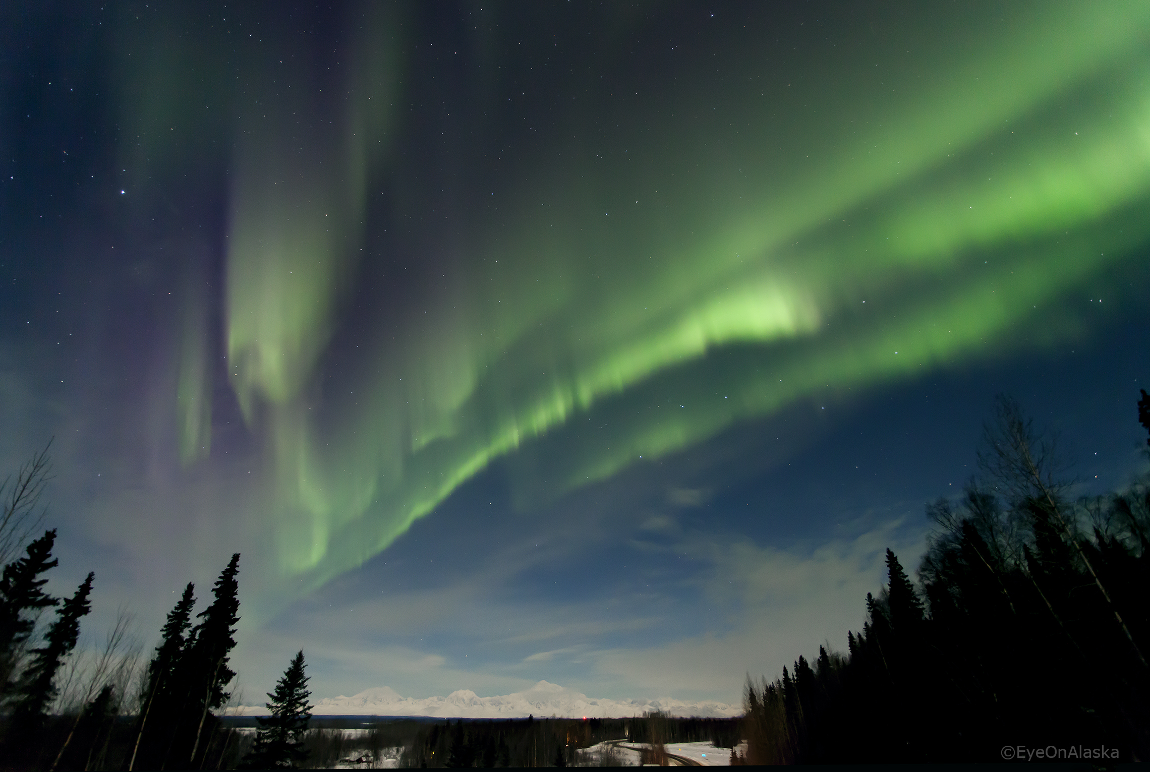 Just outside Talkeetna at the overlook. Aurora and half-moon bathing the Alaska Range. Denali in the distance. You can click on photo to view full screen.