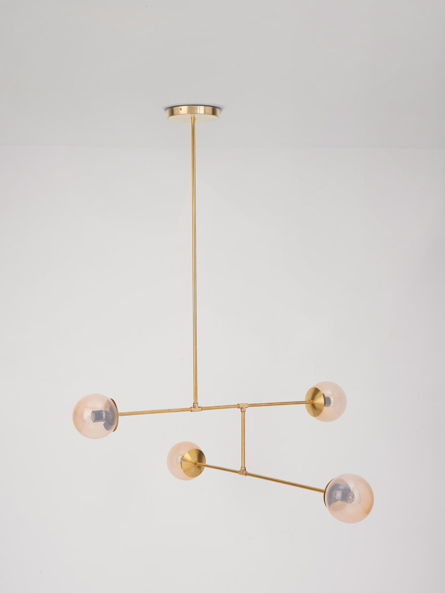'Line pendant 04' from Douglas and Bec as seen here in Blush hand blown glass creates a simple, yet glamorous feel to a formal living room or dining space.