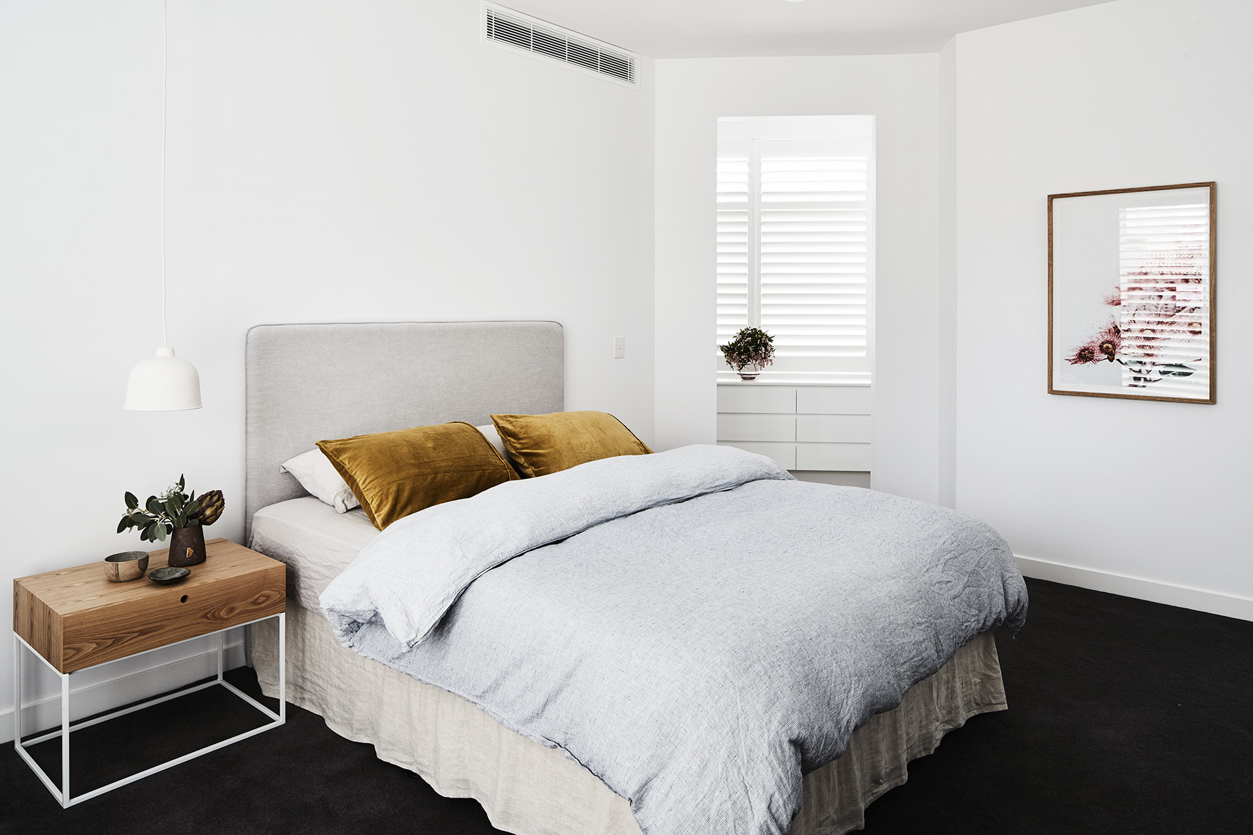 Siena bedside table, Globe West . White Check Vintage Washed Linen and valance, Adairs. Fitted sheet + pillow cases, Cultiver. Tobacco velvet pillow cases, Kip + Co. Muuto Grain Pendant light, Huset . "Flowering Gum" print, Lisa Sorgini.