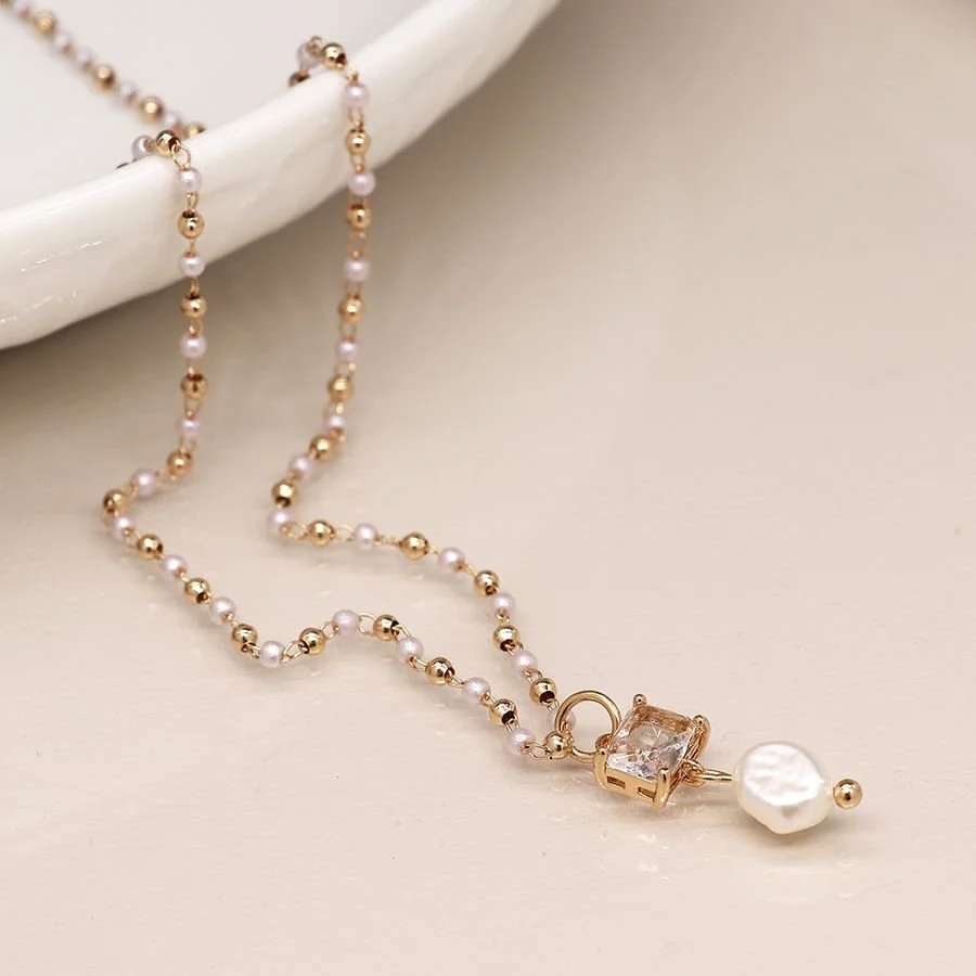 Golden bead and pearl necklace with crystal and pearl drop