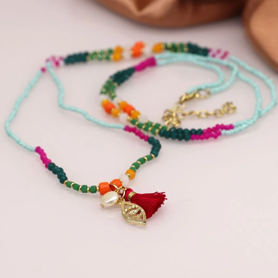 Long multicoloured boho bead necklace with tassel and charms